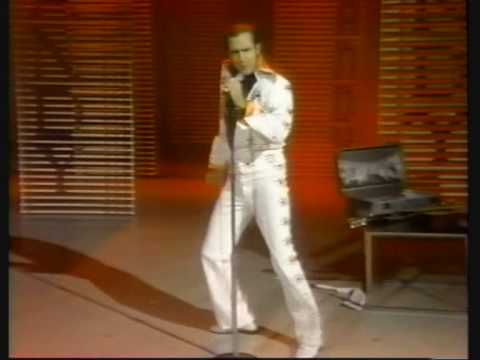 , title : 'Andy Kaufman becomes Elvis'