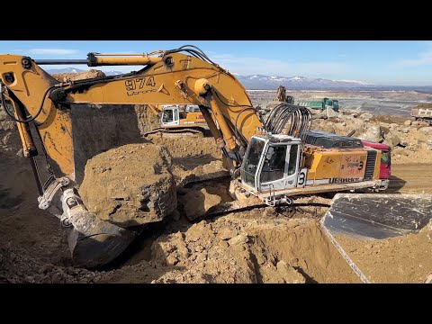 Liebherr 974 Excavator Loading Huge Rocks On Dumpers And Trucks With Soil - Ascon Ltd