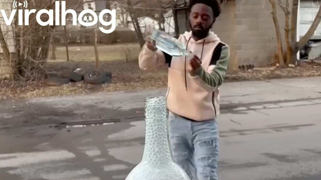 Beads Flow Perfectly Through Glass Bottles || ViralHog