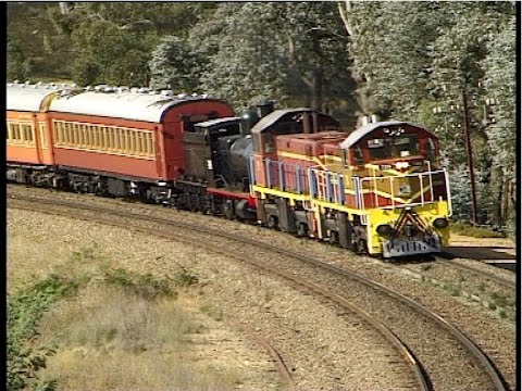 Australian diesel locomotives 7315 & 7319 hauling steam loco 2413 - Goulburn to Yass - May 2002.