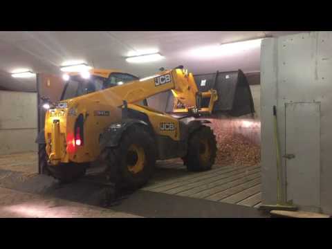 Filling up the drying floors with wet Wood Chip