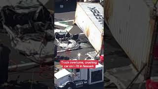Truck overturns, crushing car on I-78 in Newark