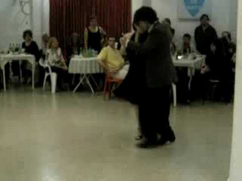  Federico Naveira  and  Inés Muzzopappa  are  dancing  to  the  tango  "  Junto A Tu Corazon  "
