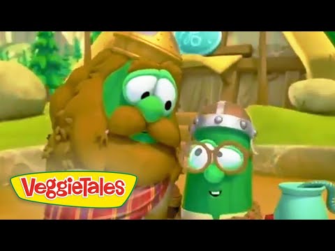 Two talking VeggieTales characters, a green cucumber and another veggie wearing helmets, smiling at each other in a sunny outdoor setting with the VeggieTales logo visible.