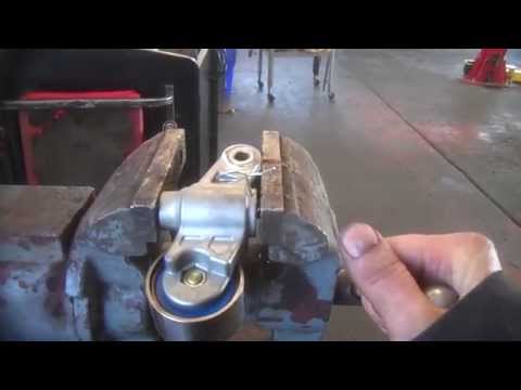 Collapsing hydraulic tensioner for many timing belt jobs