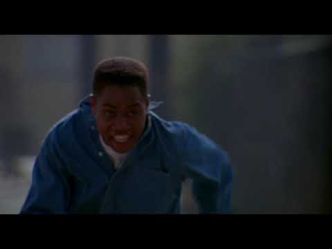 Trailer image: cruising shot of a red car as city lights glide across the windshield