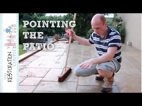 Pointing a natural stone patio using a brush in compound