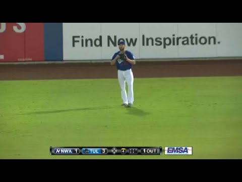 Tulsa's Garlick shows off his glove in left