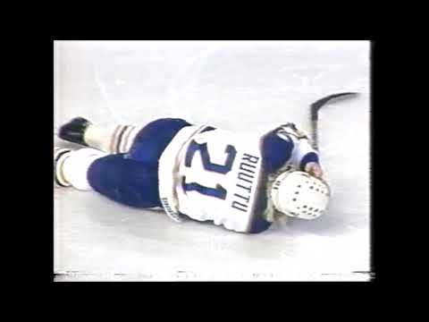 Ric Nattress cross-checks Christian Ruuttu Dec. 8/1991