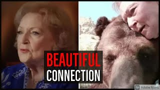 Betty White Sits Next To Big Grizzly Bear. Pops A Smooch On His Cheek