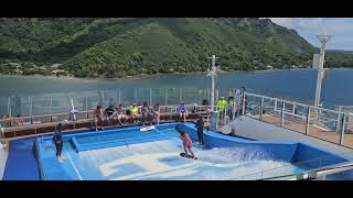 Stand Up Surfing on the Flowrider on Ovation of the Seas 04/2023 in Moorea, French Polynesia