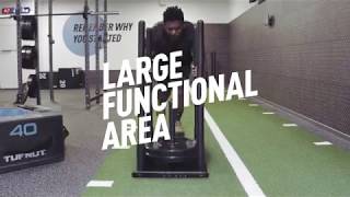 PureGym Birmingham Arcadian Centre: Gym studio with exercise bikes, resistance machines, turf area, and rubberized flooring.