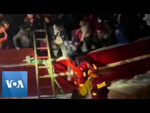 Police Enter Water to Rescue Migrants as Ship Runs Aground in Italy