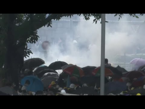 Hong Kong police used tear gas against protesters who oppose a contentious extradition bill. Wednesday's protests delayed a debate over the legislative proposal that would allow criminal suspects to be extradited to mainland China. (June 12)