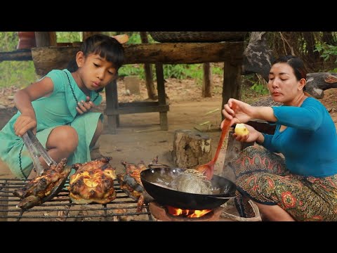 Mother cooking fish for dinner and roasted turtle spicy eating delicious