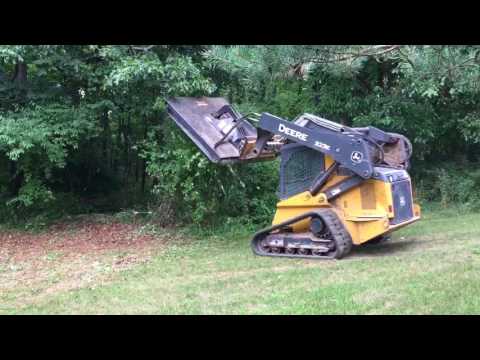 John Deere 323E Cleaning up some brush