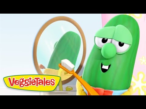 Larry the Cucumber from VeggieTales brushing teeth with an orange toothbrush in front of a round mirror.
