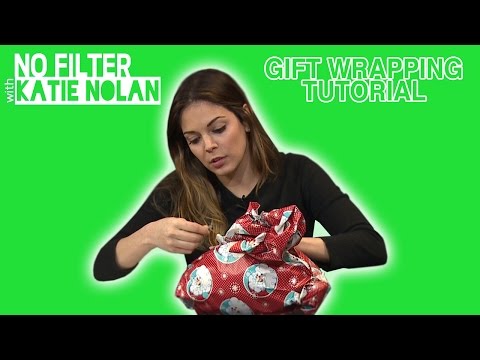 Part of a video titled How to Wrap Sports Gifts - YouTube