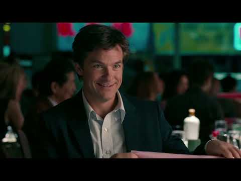 The Switch (2010) official trailer still with Jennifer Aniston and Jason Bateman crossing a New York street