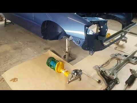 Peugeot 205 GTI suspension reconditioned and ready to be fitted to the freshly painted body shell