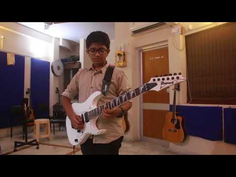chandan Student performing Guitar in Studio.