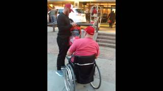 Bo Levi Mitchell signs some football cards for a fan in Edmonton