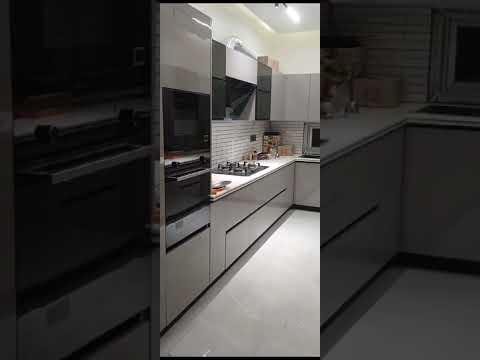 Modular kitchen by Falak Interior Decorator.