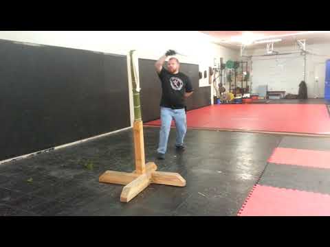 Cutting linen wrapped tatami with a rapier
