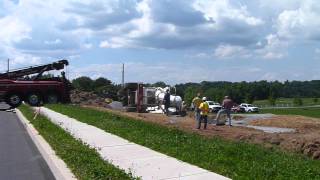 preview picture of video 'Cement truck fell in hole while attempting to pour footers.'