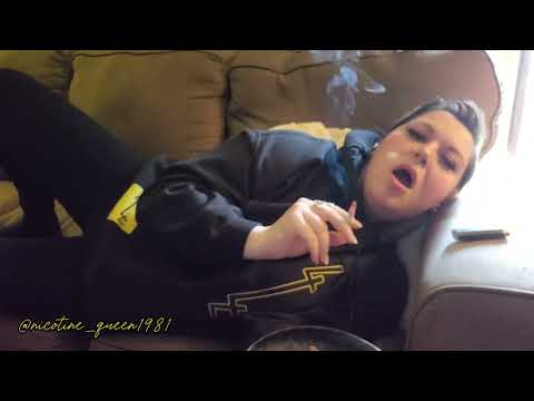 Smoking a cigarette on a sunny day.