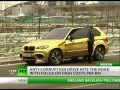 Cars made of gold bump along ruined Russian ...