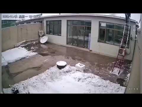 Man puts ladder up on roof when icy fail
