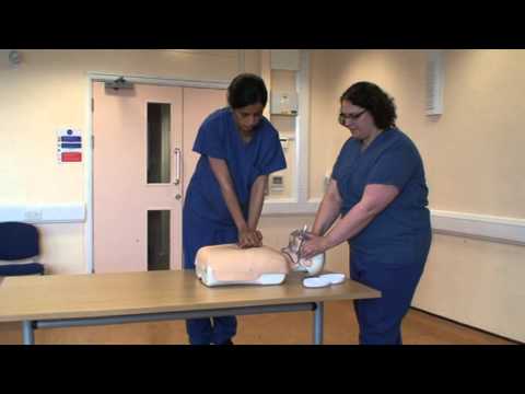 A demonstration of two person BLS demonstration 30:2 CPR and mouth to mask ventilation