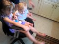 Delaney and Maya spin in the chair