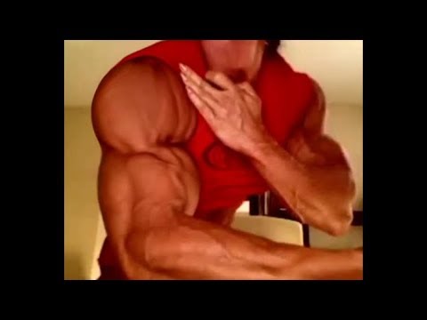 Female Bodybuilder flexing her muscles in webcam