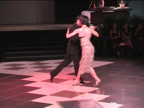  Osvaldo Zotto  and  Mariela Gisele Avanzi  are  dancing  to  the  tango  "  Tu...el Cielo Y Tu!  "