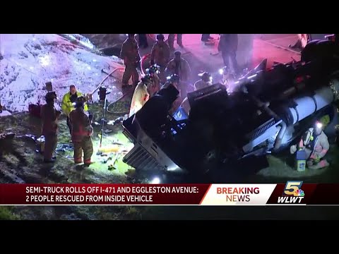 2 hospitalized after semi rolls off ramp, flips onto its top near downtown