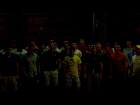 Naval Academy Men's Glee Club sing in the Gallo Winery wine cellar.