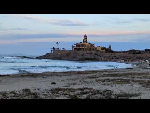 A Lone surfer awaits the first ride of a new day.