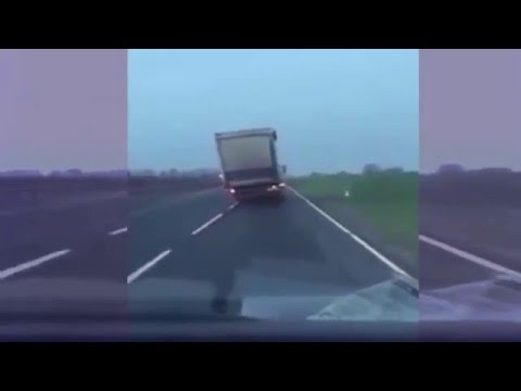 18 Wheeler Blown Onto Two Wheels By High Winds!!!!!!