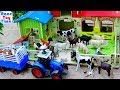 Farm Animal Toys and Barn Playset in the sandbox