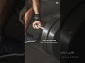 Shows A Person Lifting Weights In The Gym With Motivational Quotes In Arabic And English About Chal