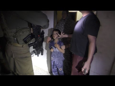 Israeli soldiers raid the Da’na home at night and wake the family.