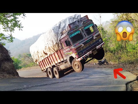 Heavy Loaded Truck Front Wheels in Air While Driving in Ghat Road - Truck Driver Difficulties