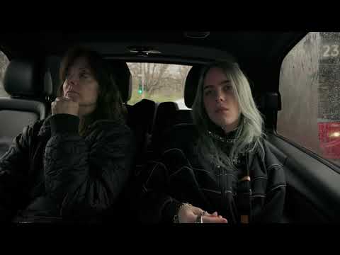 Trailer still of Billie in a candid backstage moment wearing in-ears before going onstage