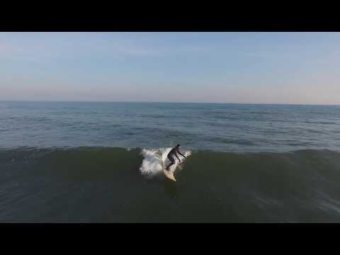 Aerial footage of surfers and fun waves at Asbury Park