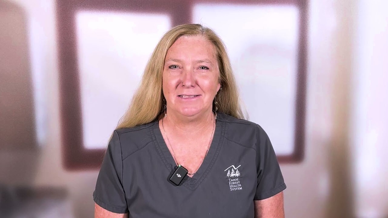 Karen Hatcher, a physical therapist, with a blurred out background.