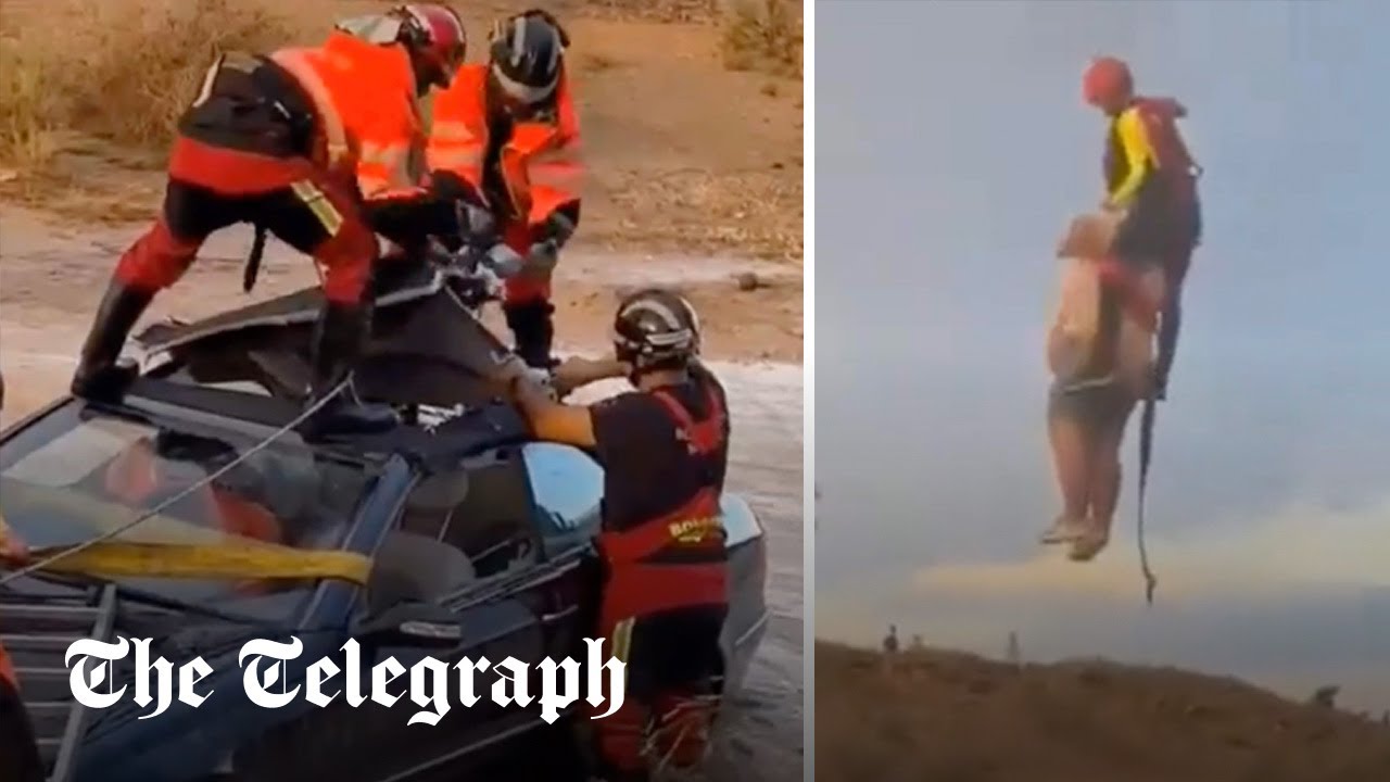 Man and woman rescued from cars as floods hit Spain 