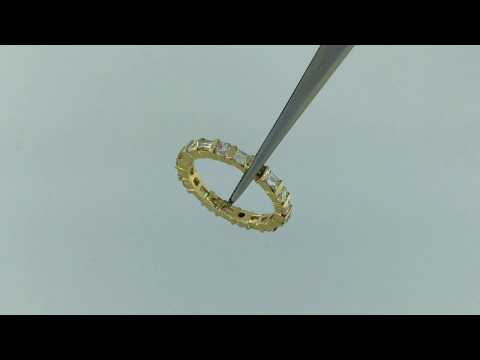 Ladies custom made diamond eternity band in 14k yellow gold.