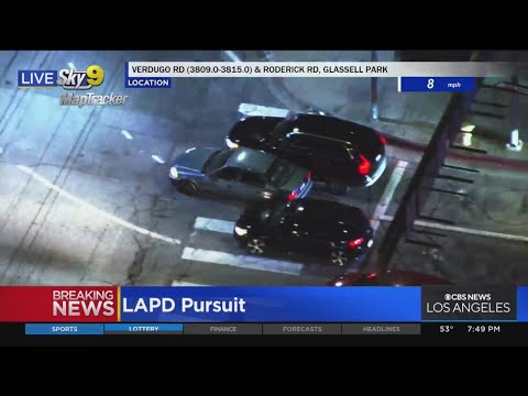 Stolen vehicle suspect splits cars stopped at red light